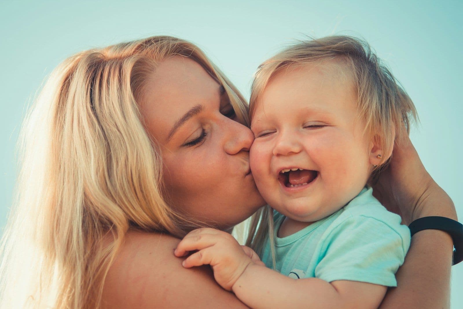 An adult sharing a happy moment with a child